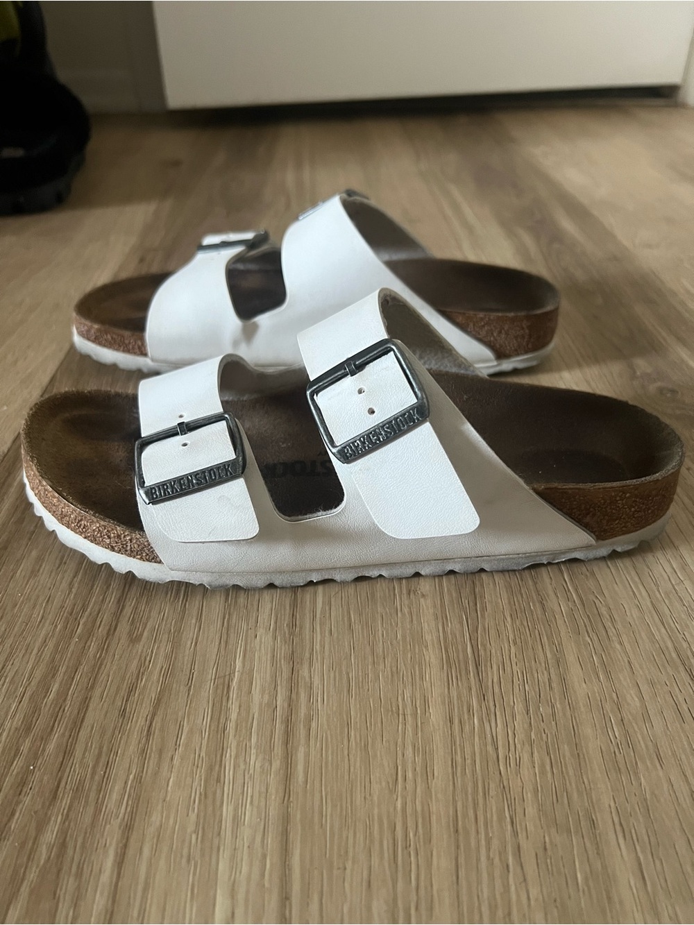 Birkenstock White Arizona Two-Strap Sandals with Silver Buckles